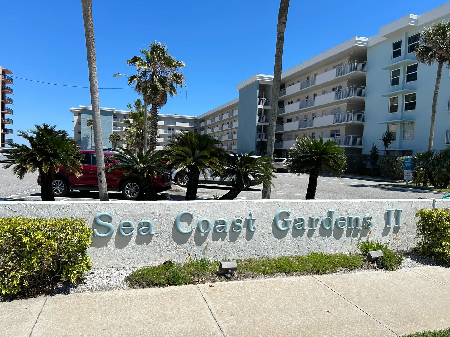 A sign that says see coast gardens
